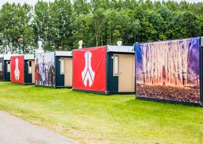 Flexotels mobile units with branding at Defqon festival